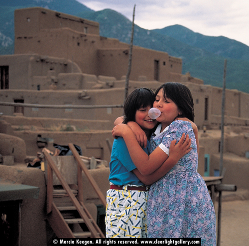 Cindy & Melanie blowing bubbles – Taos Pueblo